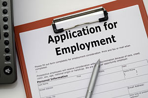 Picture of a clipboard, pen, and Application for Employment Form.